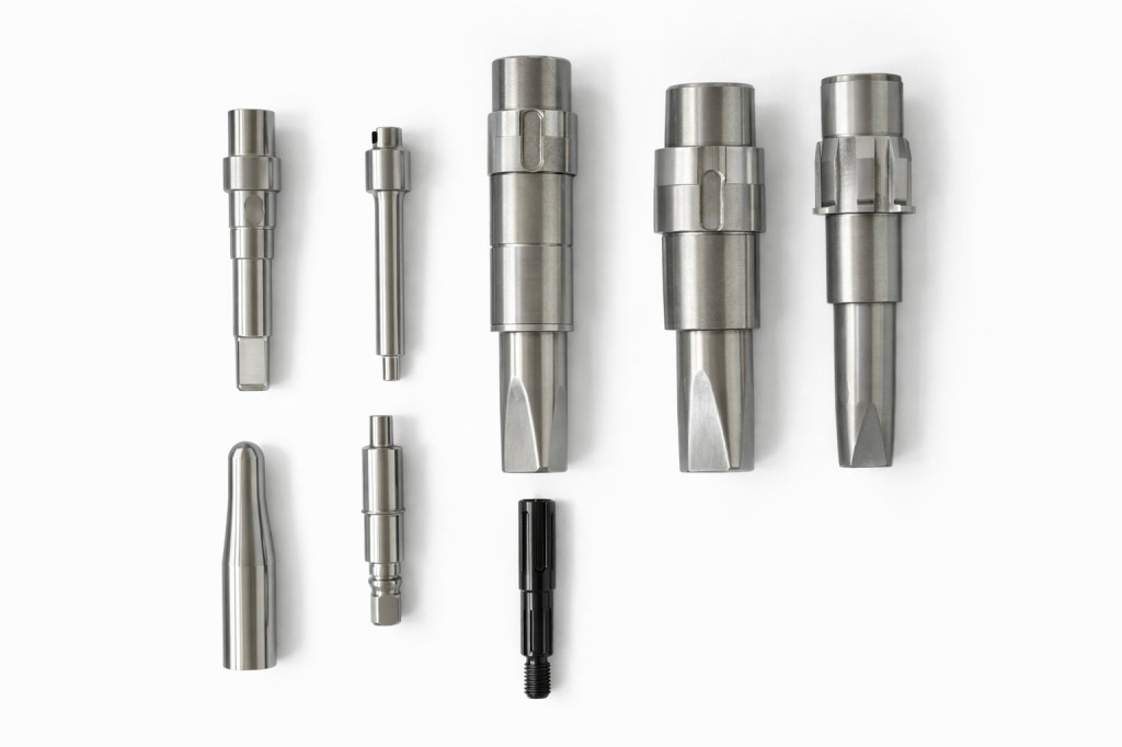 Precision CNC machined shafts and turned metal parts manufactured by Ningbo Yixin Machinery